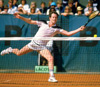 John McEnroe, tennis champion, playing a shot