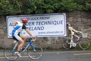 Ironman athlete on bicycle passing Alexander Technique Centre, Galway