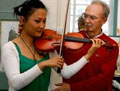 Brian McNamara, Alexander Teacher, helping a violin player